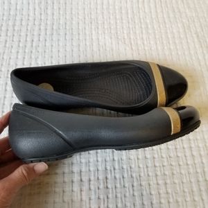 Crocs Black Cap Toe Flat Loafers with Gold Sparkle Band Stripe Toe Detail